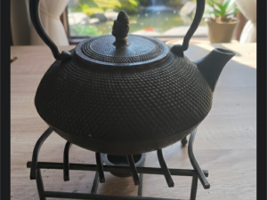 Teekanne mit Stövchen